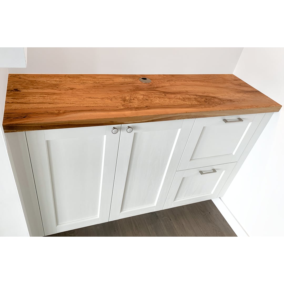 Spalted maple slab countertop on built-in cabinets